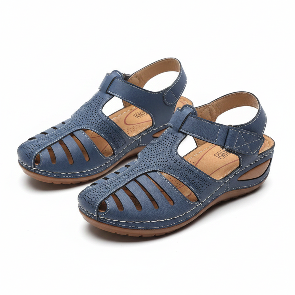Paire de sandales orthopédiques femme Vulcane bleues – vue 3/4 dessus, découpes verticales, coutures blanches et semelle compensée